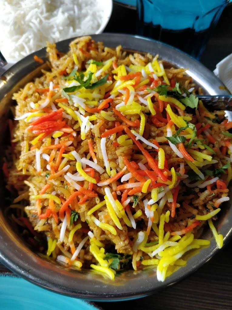 Chicken Biryani at Nosh Cafe Edmonton - Authentic Indian Rice Dish